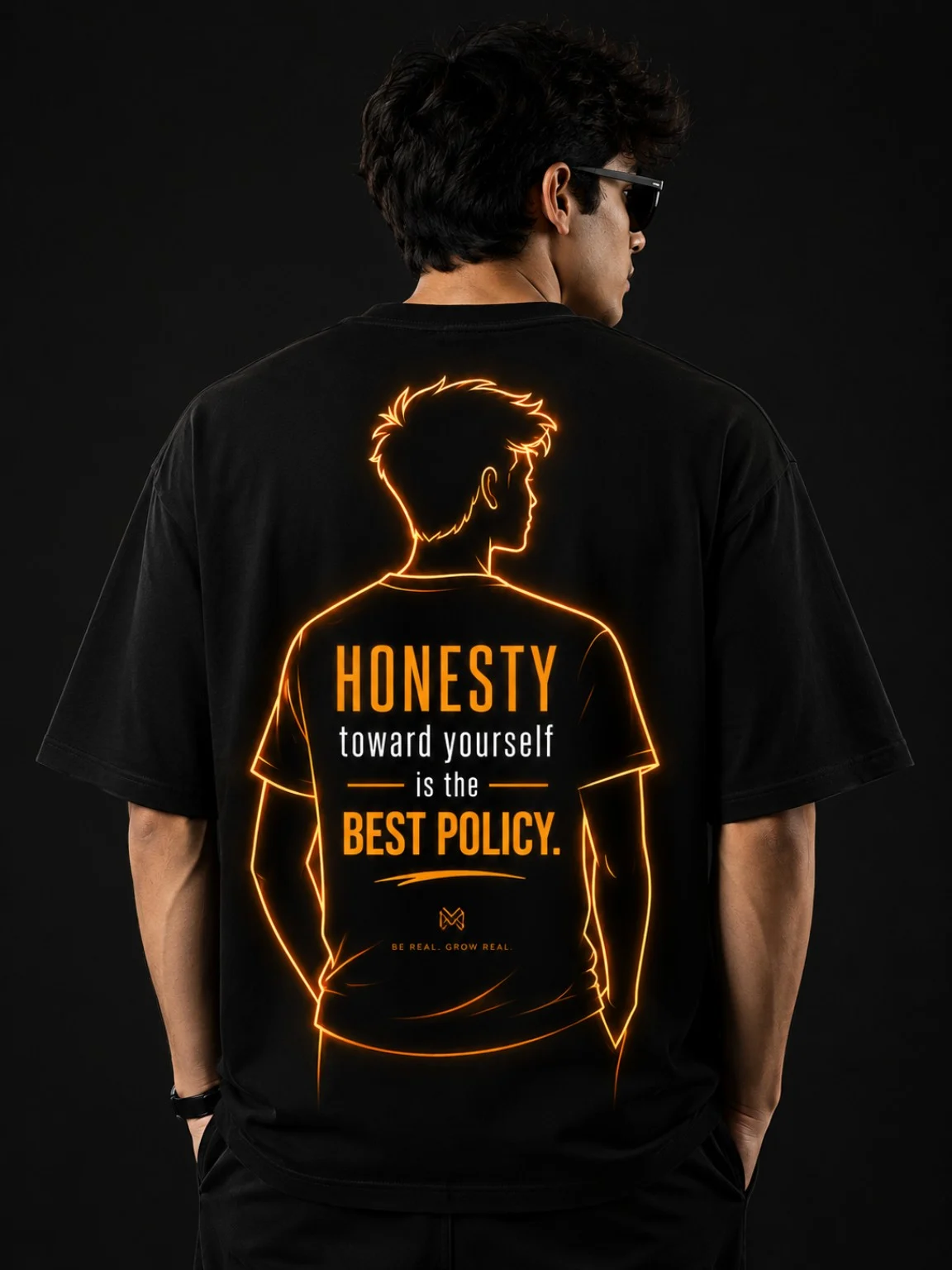 Black tee with orange Honesty toward yourself artwork, worn with the back facing the camera